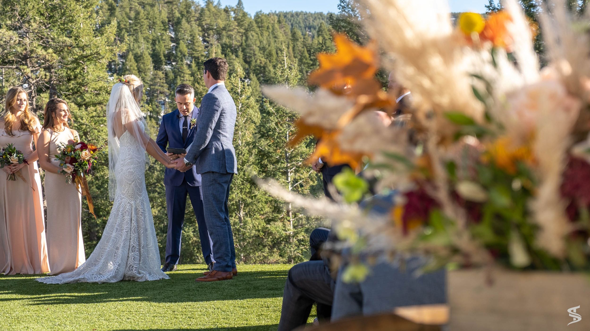 People weddings laying in grass
