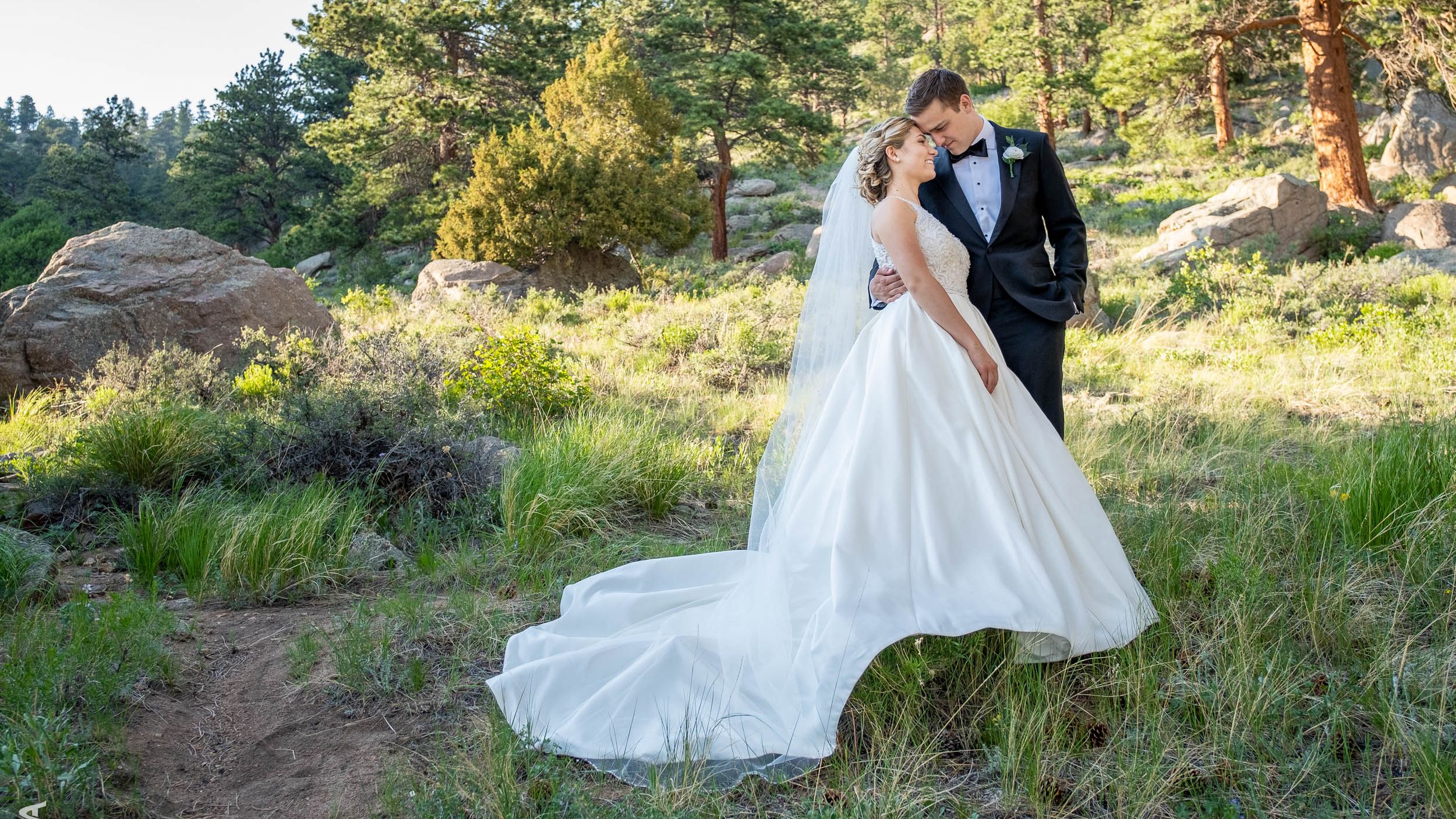 People weddings laying in grass
