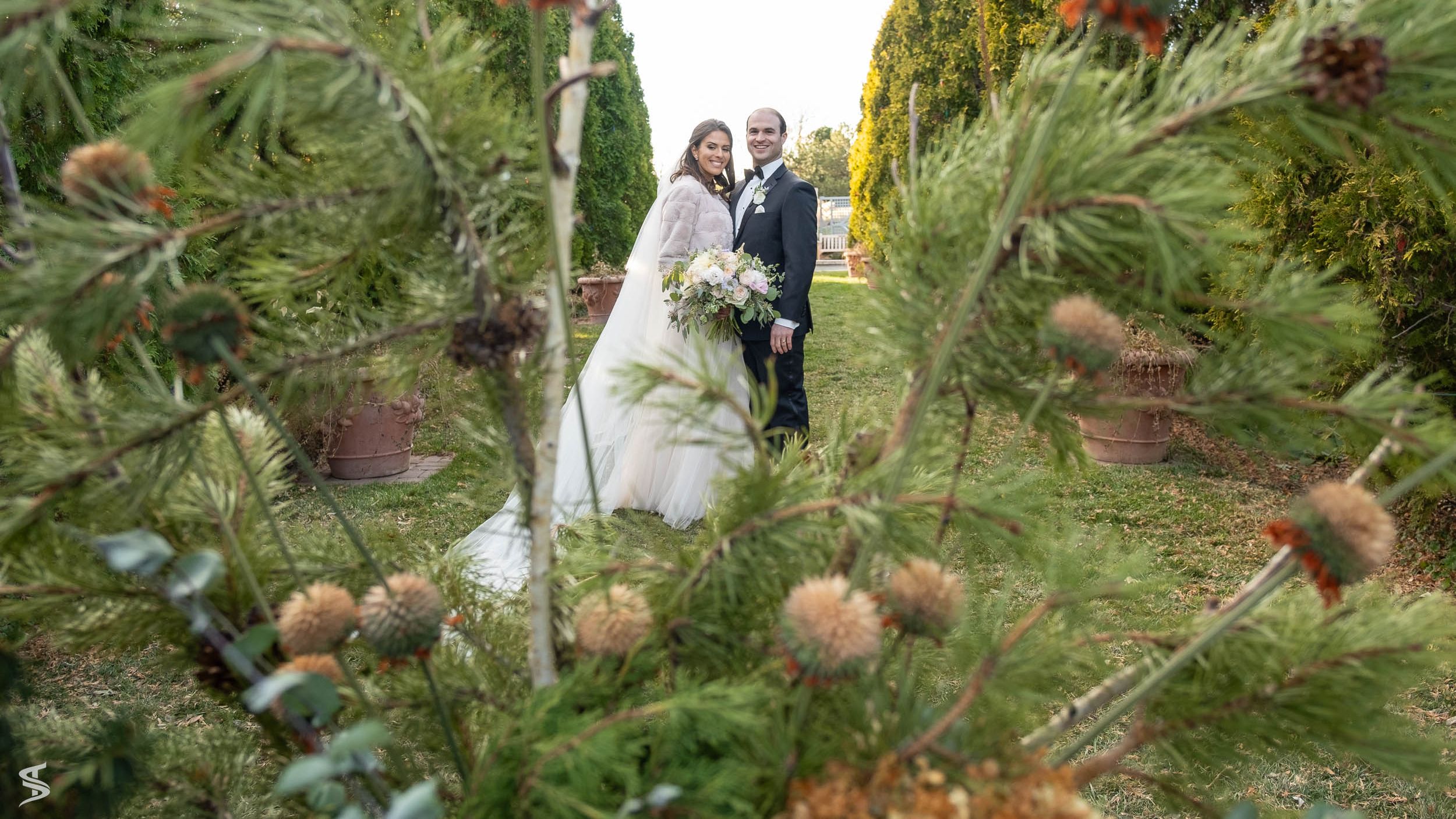 People weddings laying in grass