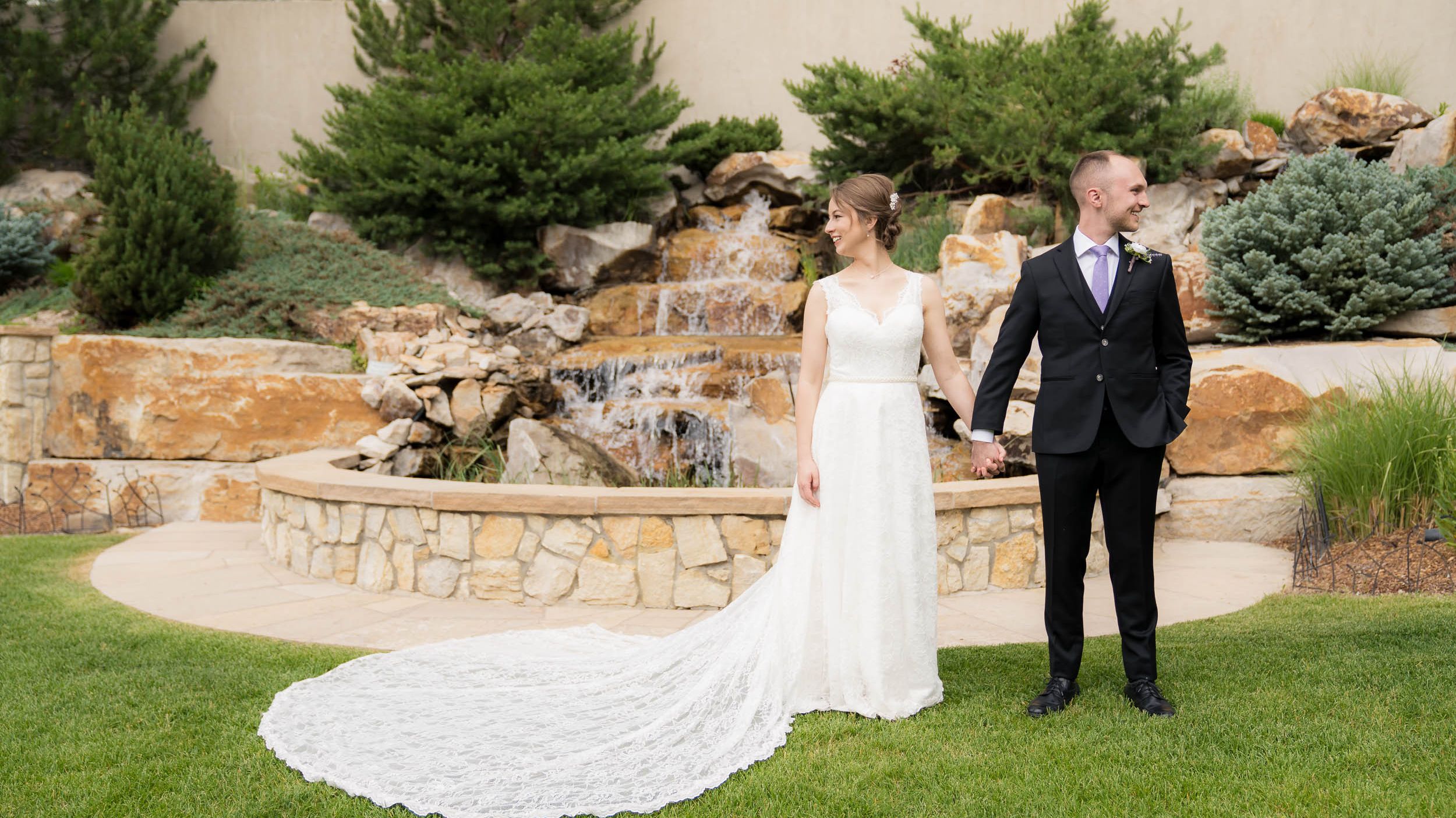 People weddings laying in grass