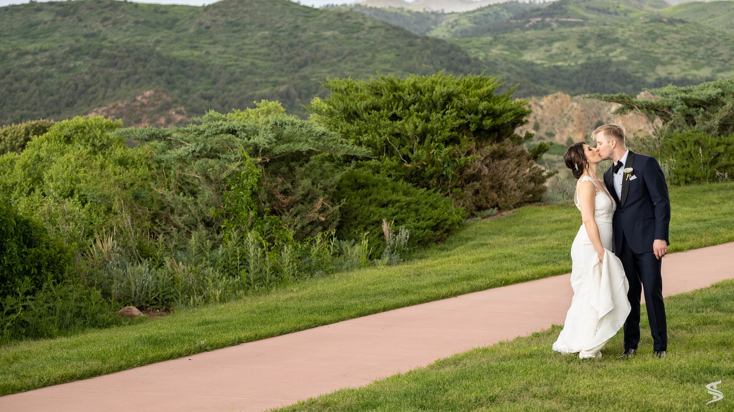 People weddings laying in grass