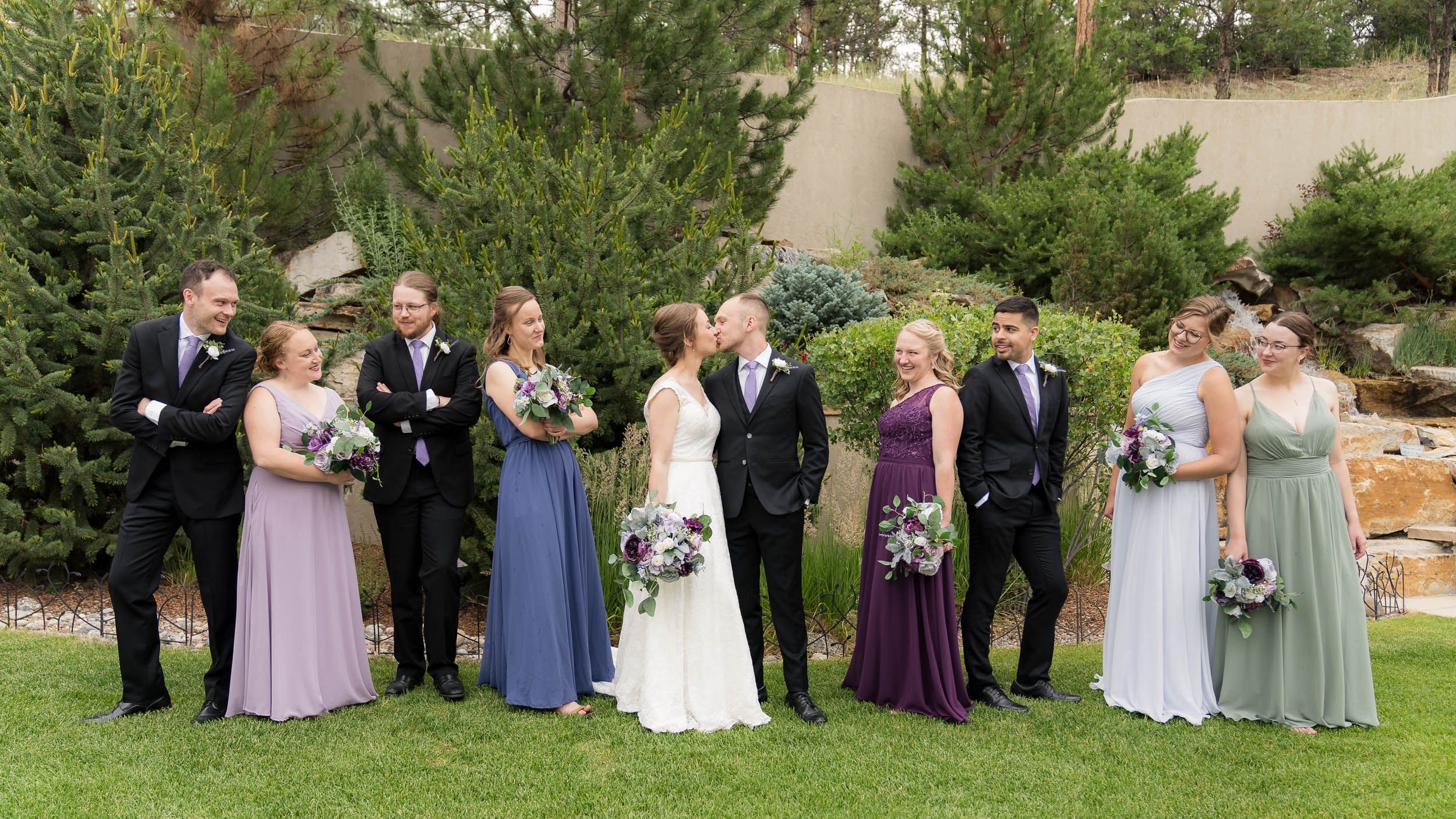People weddings laying in grass