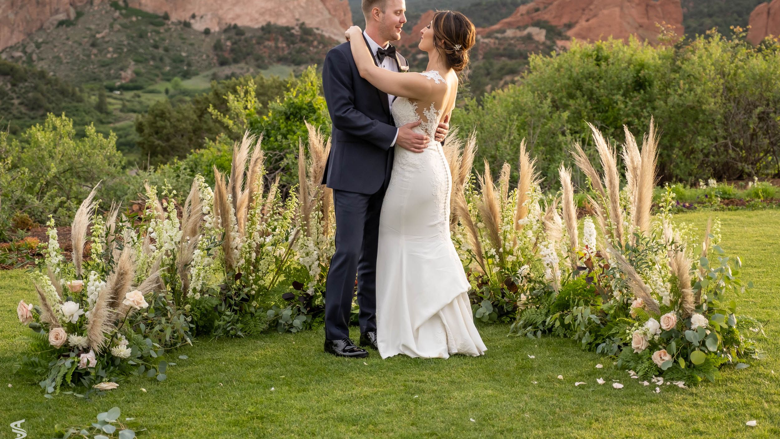 People weddings laying in grass